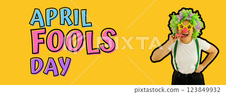 April Fool's Day, woman in clown costume on yellow background with text April Fool's Day, woman in clown costume on yellow background with text 123849932
