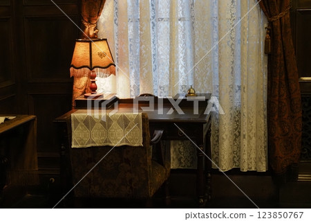 Desk and lighting in the interior of a historic building 123850767
