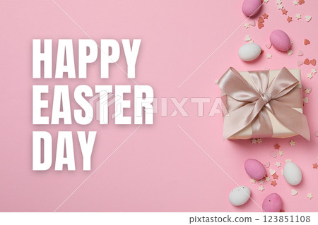 Easter, text: "Happy Easter Day" with a gift, on a pink background Easter, text: "Happy Easter Day" with a gift, on a pink background 123851108