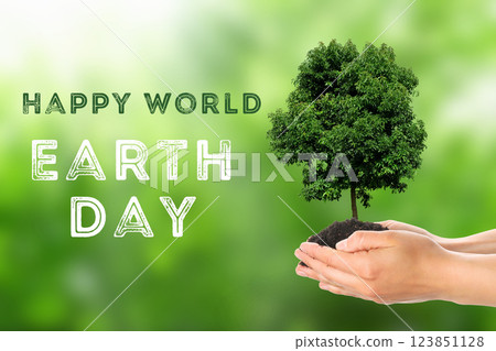 Earth Day, green tree in hands on green background, with text Earth Day, green tree in hands on green background, with text 123851128