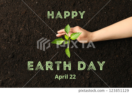 Earth Day, green sprout, hand and text on black soil background, top view Earth Day, green sprout, hand and text on black soil background, top view 123851129