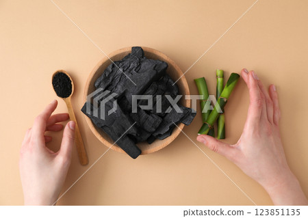Fresh bamboo shoots with charcoal in a wooden bowl Fresh bamboo shoots with charcoal in a wooden bowl 123851135