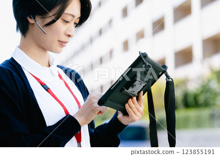 Healthcare worker operating tablet Healthcare worker operating tablet 123855191