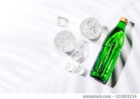 Crystal-clear glasses filled with chilled water and ice cubes Crystal-clear glasses filled with chilled water and ice cubes 123855214