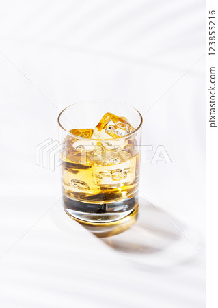 A refined glass of whiskey on the rocks 123855216