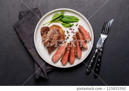 A perfectly cooked sliced striploin steak with a juicy, tender texture A perfectly cooked sliced striploin steak with a juicy, tender texture 123855392