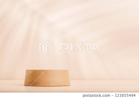 Template with podium on table and wall with natural plant shadow and sunny glare Template with podium on table and wall with natural plant shadow and sunny glare 123855494