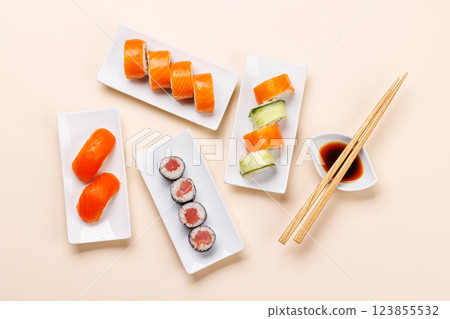Assorted sushi and maki rolls beautifully arranged on plates Assorted sushi and maki rolls beautifully arranged on plates 123855532