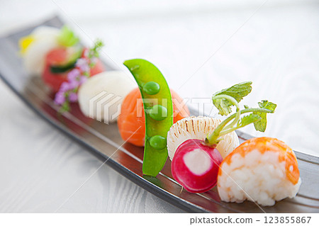 Material image of fashionable Temari sushi taken on a white background 123855867