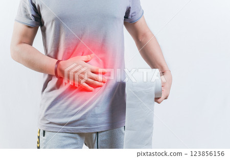 Person with diarhea holding toilet paper roll. Diarhea and stomach problems concept Person with diarhea holding toilet paper roll. Diarhea and stomach problems concept 123856156