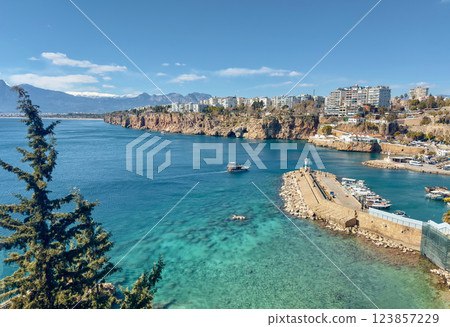 Sunny landscape with sea marina and buildings on cliff. 123857229