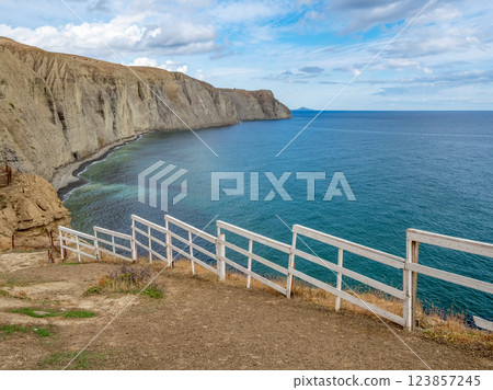 fence on top of the mountain, rocks, sea 123857245
