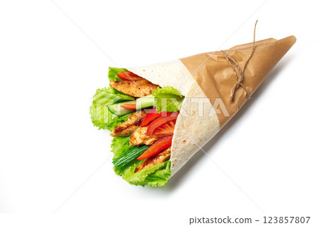 Grilled chicken wrap with fresh lettuce, tomatoes and cucumber in tortilla Grilled chicken wrap with fresh lettuce, tomatoes and cucumber in tortilla 123857807