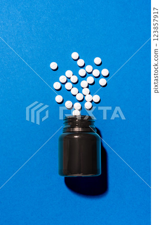 Melatonin tablets on blue background 123857917