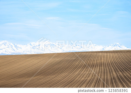 A hillside view in Biei, Hokkaido, when spring plowing begins in May A hillside view in Biei, Hokkaido, when spring plowing begins in May 123858391