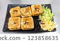 A plate of golden fried Taiwanese stinky tofu 123858635