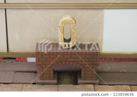 0 km post on platform 1 of the Chuo Line at JR Tokyo Station 123859636