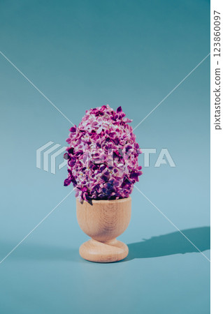Creative Easter egg shape made of lilac spring petals flowers. Minimal holiday concept still life. Copy space greeting card Creative Easter egg shape made of lilac spring petals flowers. Minimal holiday concept still life. Copy space greeting card 123860097