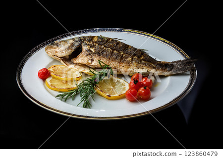 Grilled Fish Garnished with Lemon and Herbs Grilled Fish Garnished with Lemon and Herbs 123860479