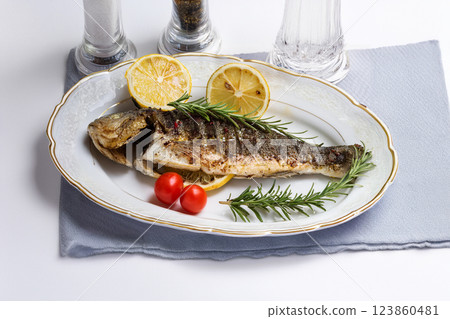 Grilled Fish Garnished with Lemon and Herbs 123860481