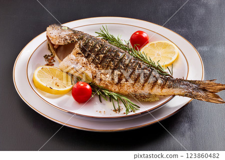 Grilled Fish Garnished with Lemon and Herbs 123860482