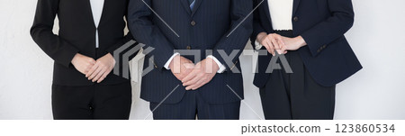 A banner with several people (3 people) in business suits standing side by side, faceless A banner with several people (3 people) in business suits standing side by side, faceless 123860534