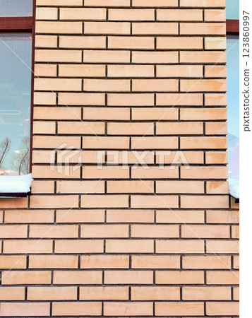 Orange brick wall background brick wall background texture background. Modern background, partition between windows 123860997