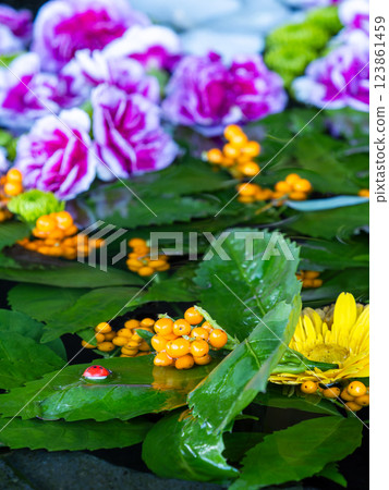 A beautiful flower water fountain decorated with January's seasonal flowers A beautiful flower water fountain decorated with January's seasonal flowers 123861459