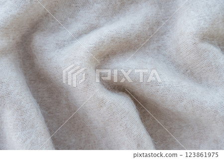 Close-up of soft white mohair fabric with delicate fibers and fluffy texture 123861975