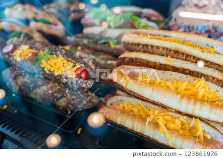 Fresh white and whole grain panini sandwich with cheddar cheese, cherry tomatoes in a bakery display 123861976