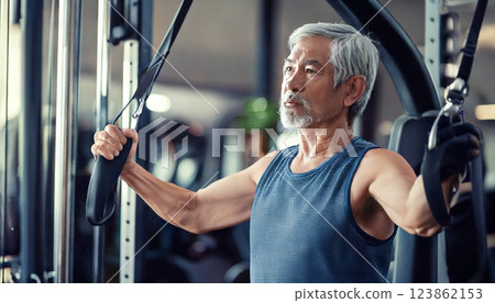 A gray-haired senior man working out at the gym (AI-generated image) 123862153