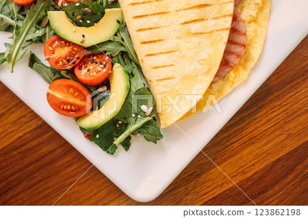 Toasted Tortilla with Sausage for Breakfast Toasted Tortilla with Sausage for Breakfast 123862198