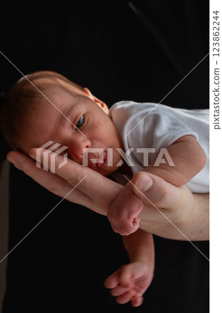 Newborn Baby Cradled in Hand Newborn Baby Cradled in Hand 123862244