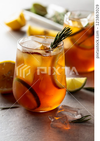 Refreshing hard seltzer with lemon, lime and ice garnished with rosemary twigs. 123863029