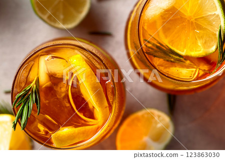 Refreshing hard seltzer with lemon, lime and ice garnished with rosemary twigs. Refreshing hard seltzer with lemon, lime and ice garnished with rosemary twigs. 123863030