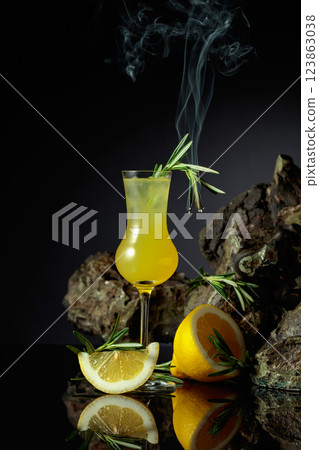 Traditional homemade lemon liqueur limoncello on the black background. 123863038