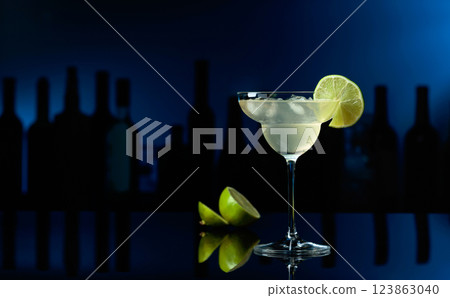 Cocktail Margarita on a black table in a bar. Cocktail Margarita on a black table in a bar. 123863040