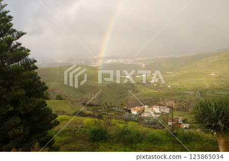 Rainbow over Valle Jimenez. 123865034