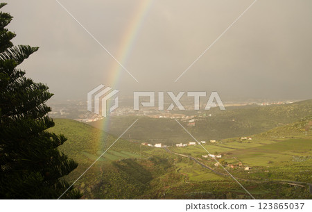 Rainbow over Valle Jimenez. 123865037