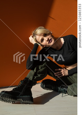 Beautiful fashion blonde woman in military clothes Beautiful fashion blonde woman in military clothes 123865353