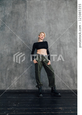 Beautiful fashion blonde woman in military clothes Beautiful fashion blonde woman in military clothes 123865355