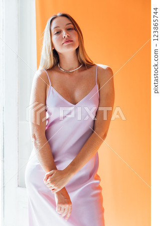 Portrait of a beautiful fashionable woman in a summer light dress 123865744