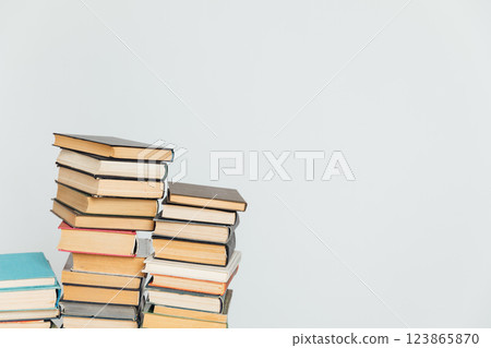 Stacks of old educational books on a white background of a school library 123865870