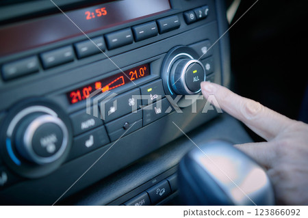 Middle-aged woman in a suit driving a car 123866092