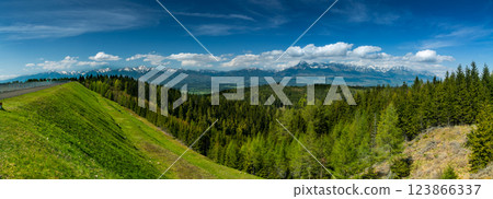 The most famous Slovak peak in the High Tatras - Krivan. A view of the Cierny Vah hydroelectric power plant. 123866337