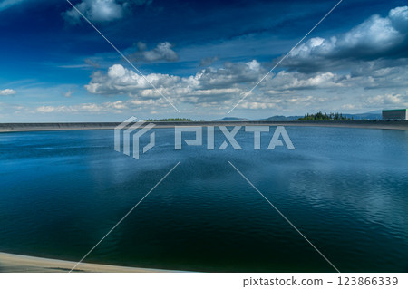 The most famous Slovak peak in the High Tatras - Krivan. A view of the Cierny Vah hydroelectric power plant. 123866339