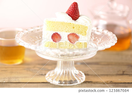 Strawberry shortcake on a cake stand and tea Strawberry shortcake on a cake stand and tea 123867084