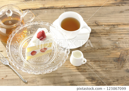 Strawberry shortcake on a cake stand and tea 123867099