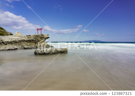 Beautiful coastal scenery with torii gates Beautiful coastal scenery with torii gates 123867321