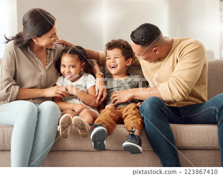 Playful, children and parents on the sofa for love, care and happiness in the living room of home together. Portrait of happy, smile and young kids playing with their mother and father on the couch Playful, children and parents on the sofa for love, care and happiness in the living room of home together. Portrait of happy, smile and young kids playing with their mother and father on the couch 123867410
